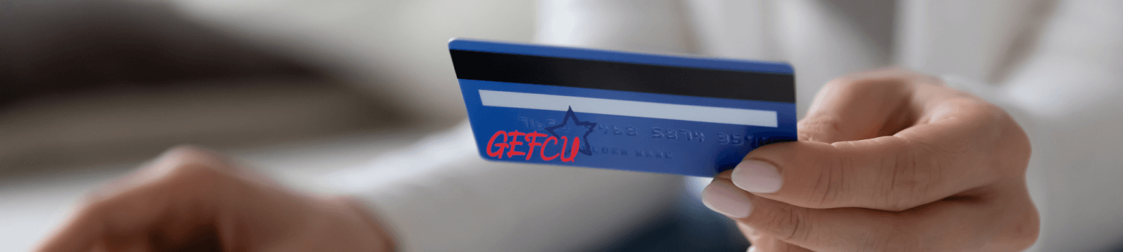 Someone holding a GEFCU card
