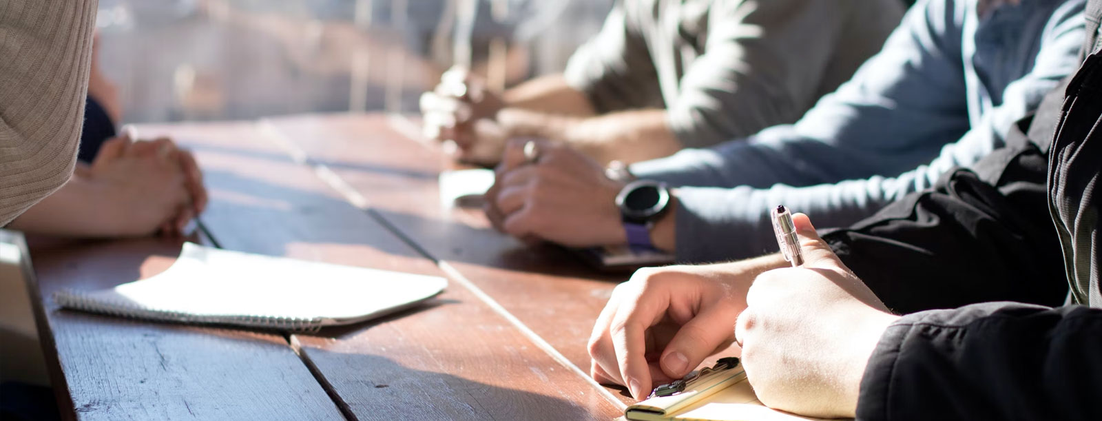 Group of business people sitting at table