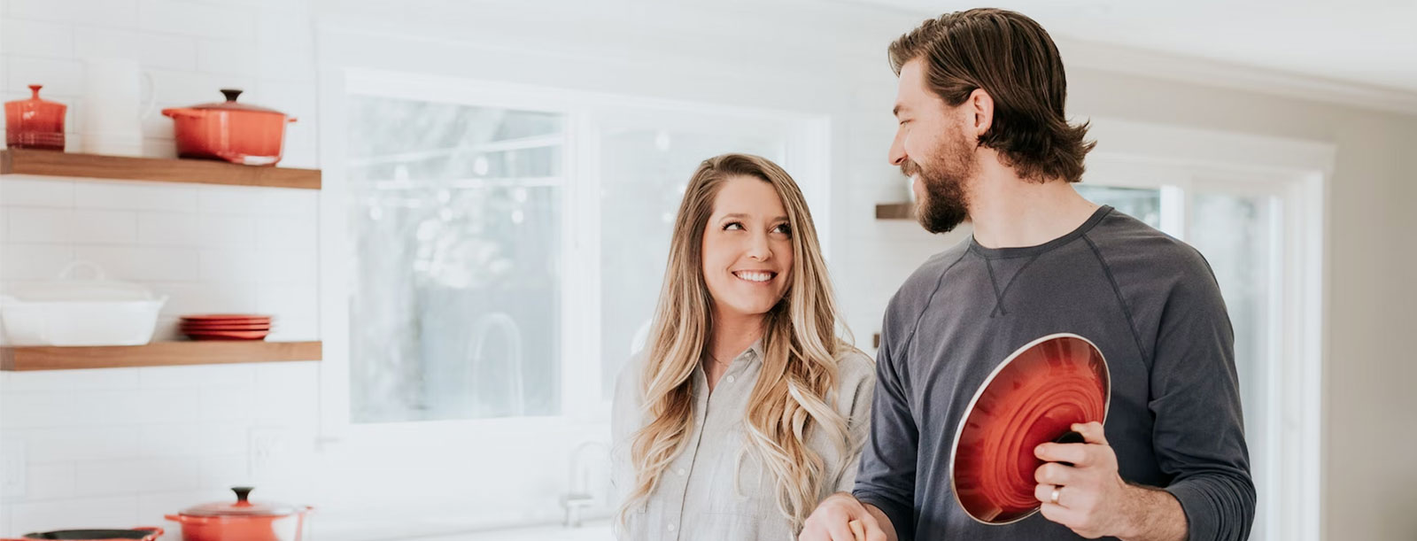 Young couple cooking in kitchen